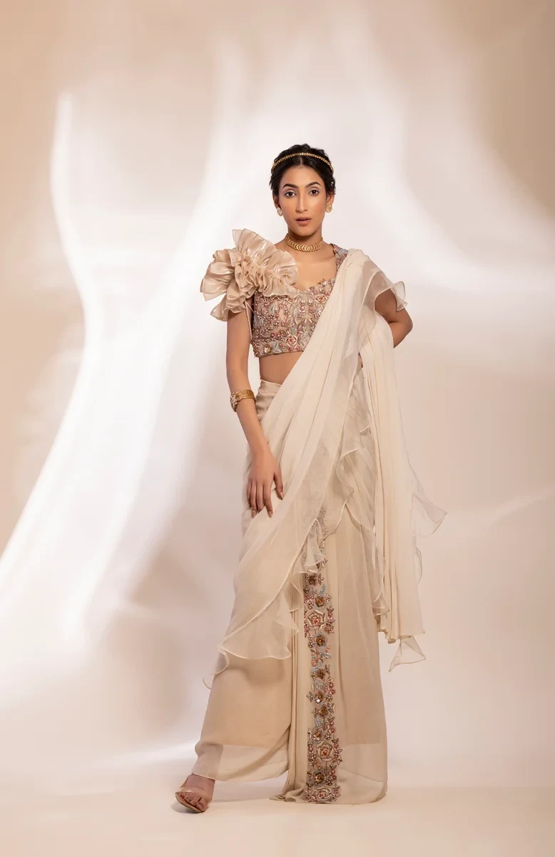 Drape shimmer saree worn with organza ruffle